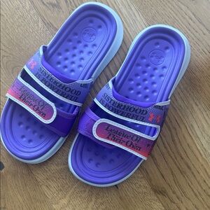 Under Armour Kids Purple Slide Sandals with Pink Accent Graphics